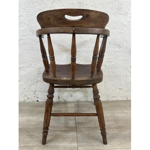 1 - A Victorian elm and beech smoker's bow chair, stamped to base Price & Wilding Makers Nantwich and im... 