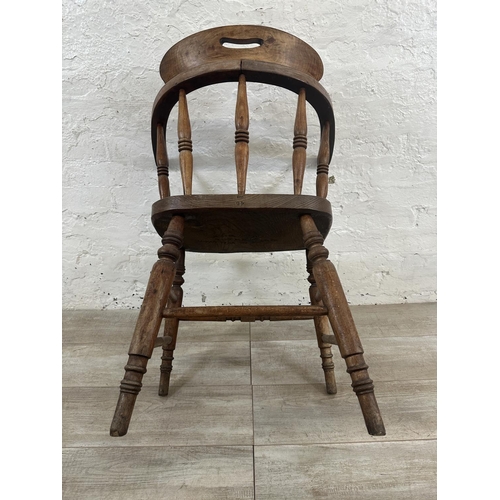 1 - A Victorian elm and beech smoker's bow chair, stamped to base Price & Wilding Makers Nantwich and im... 