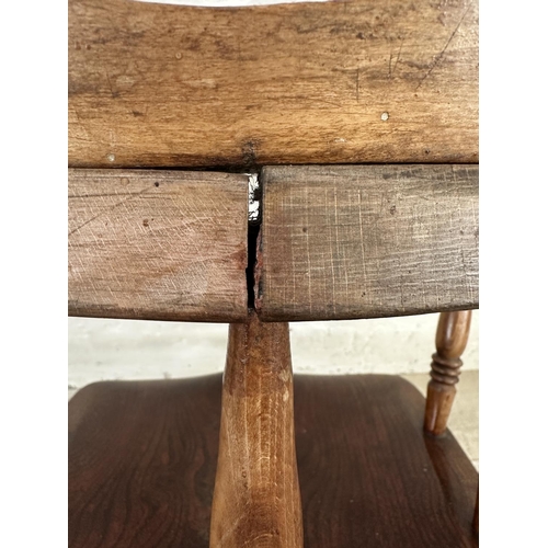 1 - A Victorian elm and beech smoker's bow chair, stamped to base Price & Wilding Makers Nantwich and im... 