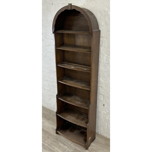 103 - An oak arched top seven tier bookcase - approx. 172cm high x 54cm wide x 18cm deep