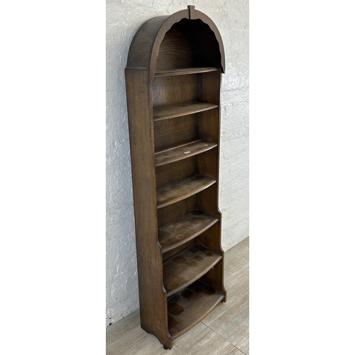 103 - An oak arched top seven tier bookcase - approx. 172cm high x 54cm wide x 18cm deep