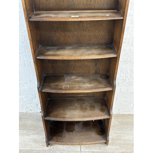 103 - An oak arched top seven tier bookcase - approx. 172cm high x 54cm wide x 18cm deep