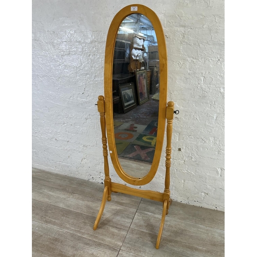 104 - A beech framed oval cheval mirror - approx. 150cm high x 52cm wide x 50cm deep