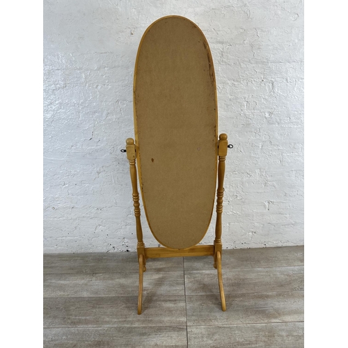 104 - A beech framed oval cheval mirror - approx. 150cm high x 52cm wide x 50cm deep