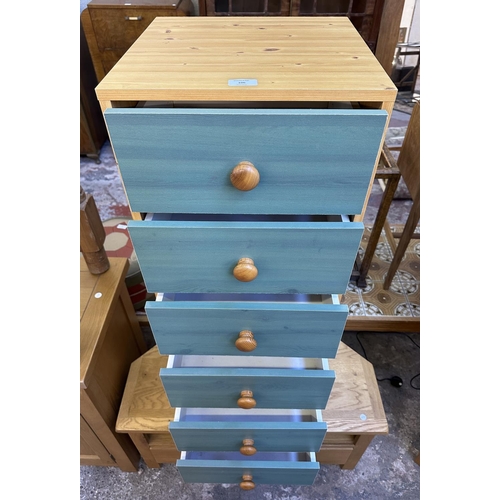 106 - A modern pine effect and green painted chest of drawers - approx. 107cm high x 39.5cm wide x 39.5cm ... 