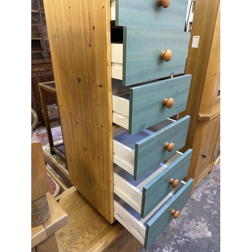 106 - A modern pine effect and green painted chest of drawers - approx. 107cm high x 39.5cm wide x 39.5cm ... 