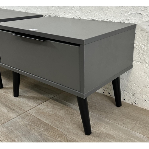 111 - A pair of modern grey laminate bedside cabinets - approx. 42cm high x 57cm wide x 39cm deep