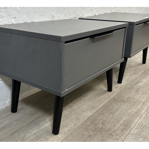 111 - A pair of modern grey laminate bedside cabinets - approx. 42cm high x 57cm wide x 39cm deep