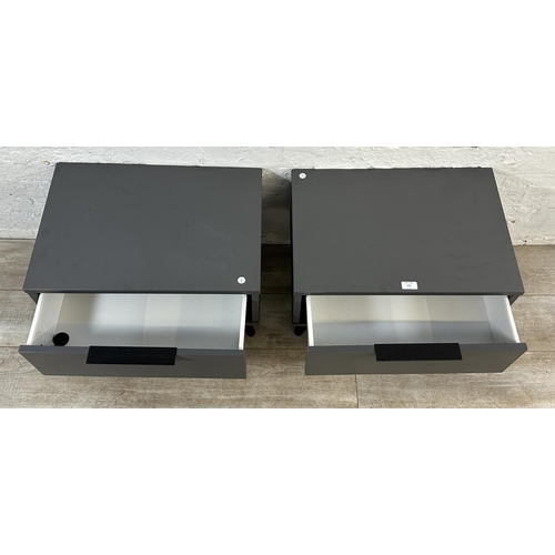 111 - A pair of modern grey laminate bedside cabinets - approx. 42cm high x 57cm wide x 39cm deep