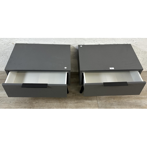 111 - A pair of modern grey laminate bedside cabinets - approx. 42cm high x 57cm wide x 39cm deep