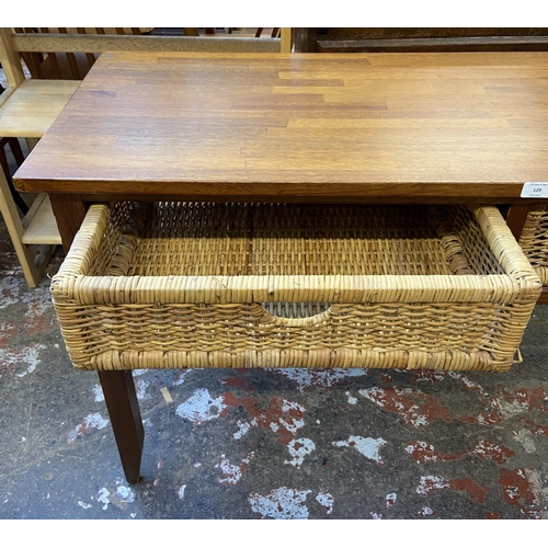 129 - A modern hardwood and wicker two drawer console table - approx. 71cm high x 125cm wide x 45cm deep