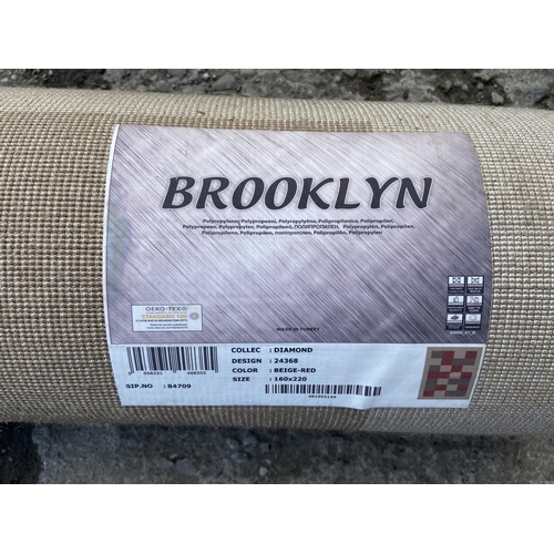 130 - A Brooklyn Diamond beige and red polypropylene rug  - approx. 220cm x 160cm