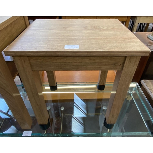 132 - Two modern oak effect side tables - largest approx. 46cm high x 33cm wide x 48cm long