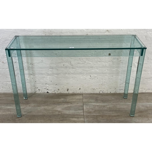 133 - A modern glass console table - approx. 75cm high x 121cm wide x 35cm deep