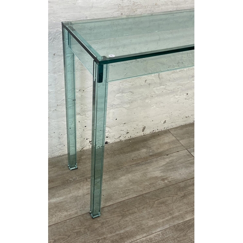 133 - A modern glass console table - approx. 75cm high x 121cm wide x 35cm deep