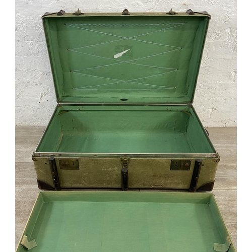 138 - An early/mid 20th century wooden banded green canvas and brown leather travel trunk, patent no. 2316... 