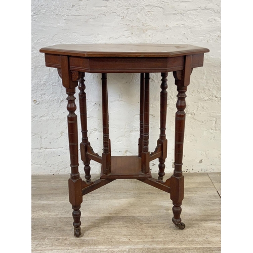 148 - A Victorian walnut octagonal two tier side table - approx. 70cm high x 59cm wide x 59cm deep