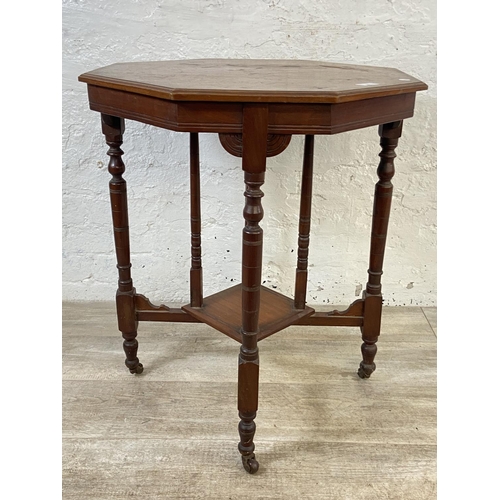 148 - A Victorian walnut octagonal two tier side table - approx. 70cm high x 59cm wide x 59cm deep