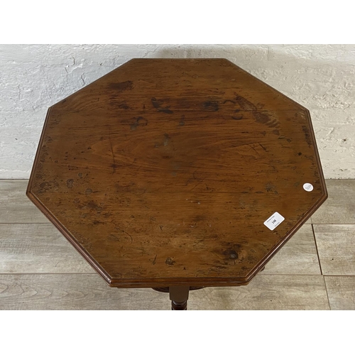 148 - A Victorian walnut octagonal two tier side table - approx. 70cm high x 59cm wide x 59cm deep