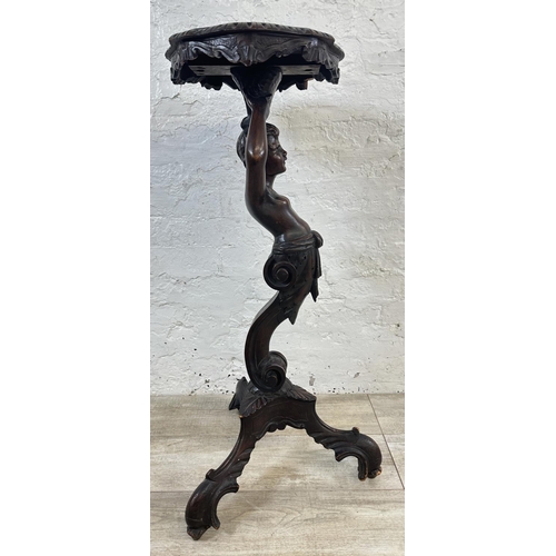 15 - A 19th century carved walnut tripod pedestal jardinière stand with putti design - approx. 95cm high