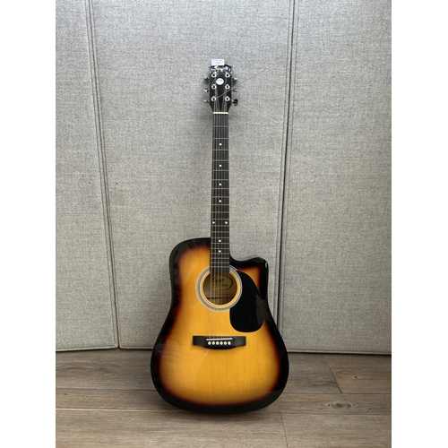 761 - A Squier SA-105CE Dreadnought Cutaway steel strung electro-acoustic guitar