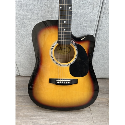 761 - A Squier SA-105CE Dreadnought Cutaway steel strung electro-acoustic guitar