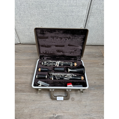 764A - A cased Buescher Aristocrat clarinet