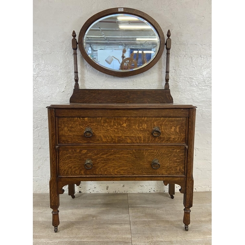 155 - An early 20th century oak dressing chest - approx. 152cm high x 91cm wide x 48cm deep