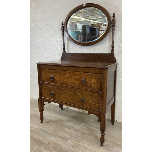 155 - An early 20th century oak dressing chest - approx. 152cm high x 91cm wide x 48cm deep