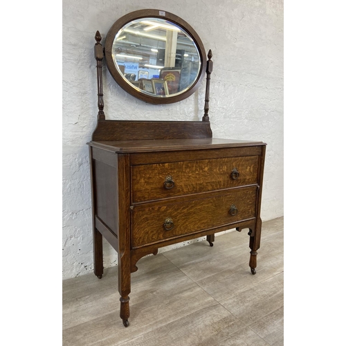 155 - An early 20th century oak dressing chest - approx. 152cm high x 91cm wide x 48cm deep