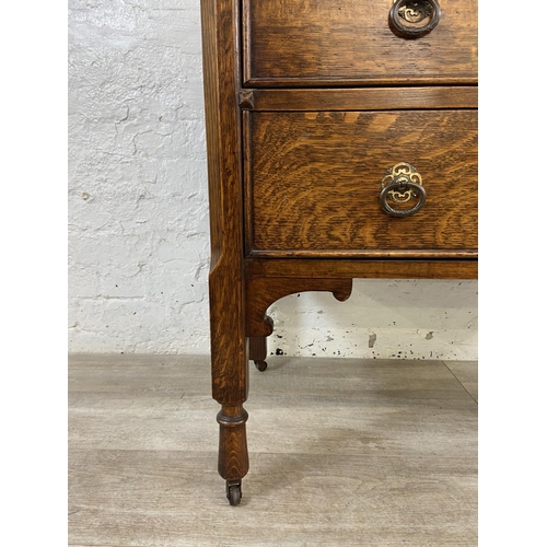 155 - An early 20th century oak dressing chest - approx. 152cm high x 91cm wide x 48cm deep