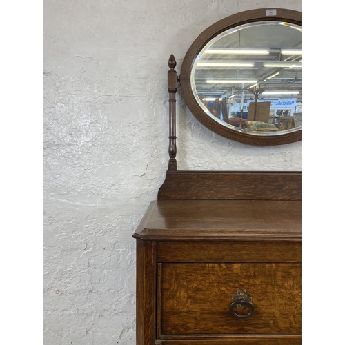 155 - An early 20th century oak dressing chest - approx. 152cm high x 91cm wide x 48cm deep