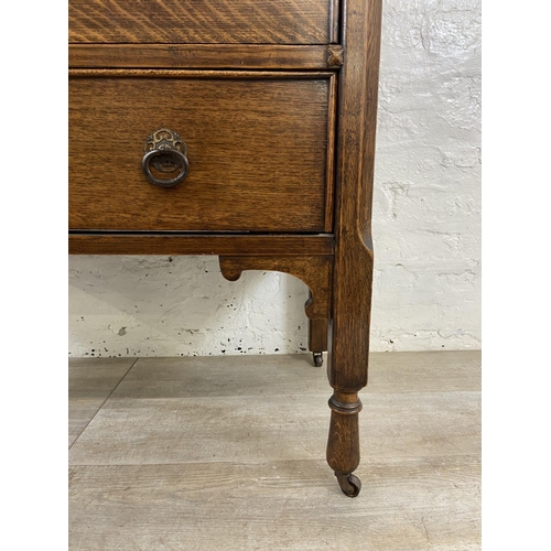 156 - An early 20th century oak chest of drawers - approx. 88cm high x 91cm wide x 48cm deep