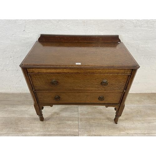 156 - An early 20th century oak chest of drawers - approx. 88cm high x 91cm wide x 48cm deep