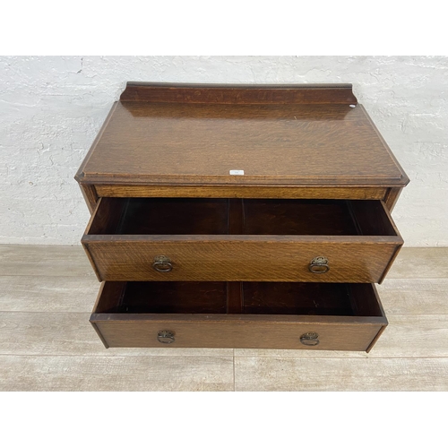 156 - An early 20th century oak chest of drawers - approx. 88cm high x 91cm wide x 48cm deep