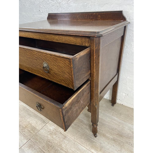 156 - An early 20th century oak chest of drawers - approx. 88cm high x 91cm wide x 48cm deep