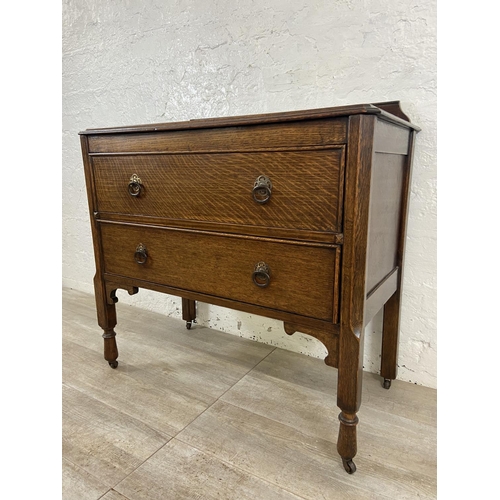 156 - An early 20th century oak chest of drawers - approx. 88cm high x 91cm wide x 48cm deep