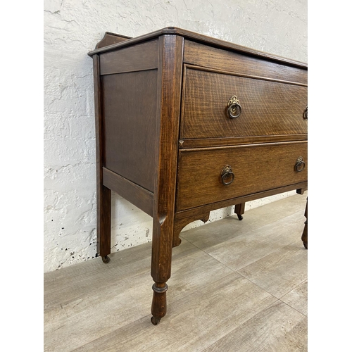 156 - An early 20th century oak chest of drawers - approx. 88cm high x 91cm wide x 48cm deep