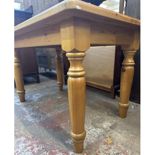 169 - A pine dining table - approx. 74cm high x 76cm wide x 121cm long