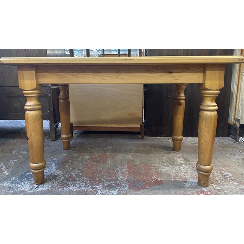 169 - A pine dining table - approx. 74cm high x 76cm wide x 121cm long