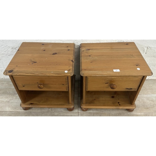 172 - A pair of pine bedside cabinets - approx. 46cm high x 46cm wide x 39cm deep