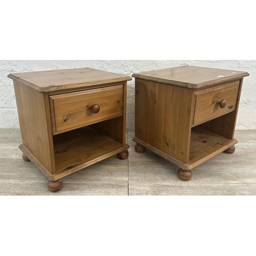 172 - A pair of pine bedside cabinets - approx. 46cm high x 46cm wide x 39cm deep