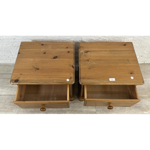 172 - A pair of pine bedside cabinets - approx. 46cm high x 46cm wide x 39cm deep