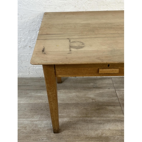 176 - A mid 20th century beech two drawer school desk - approx. 77cm high x 153cm wide x 77cm deep