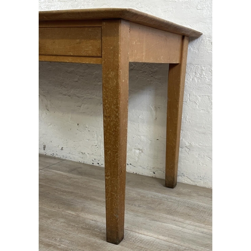 176 - A mid 20th century beech two drawer school desk - approx. 77cm high x 153cm wide x 77cm deep