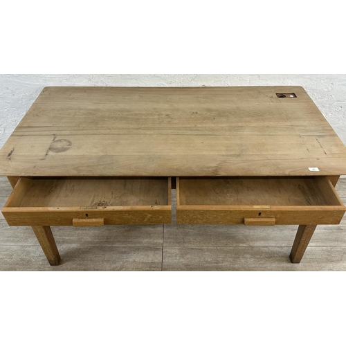 176 - A mid 20th century beech two drawer school desk - approx. 77cm high x 153cm wide x 77cm deep