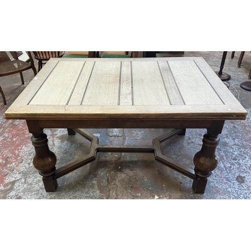 179 - A 1930s oak draw leaf dining table - approx. 78cm high x 100cm wide x 140cm long