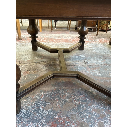 179 - A 1930s oak draw leaf dining table - approx. 78cm high x 100cm wide x 140cm long