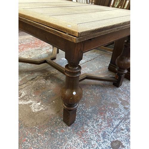 179 - A 1930s oak draw leaf dining table - approx. 78cm high x 100cm wide x 140cm long