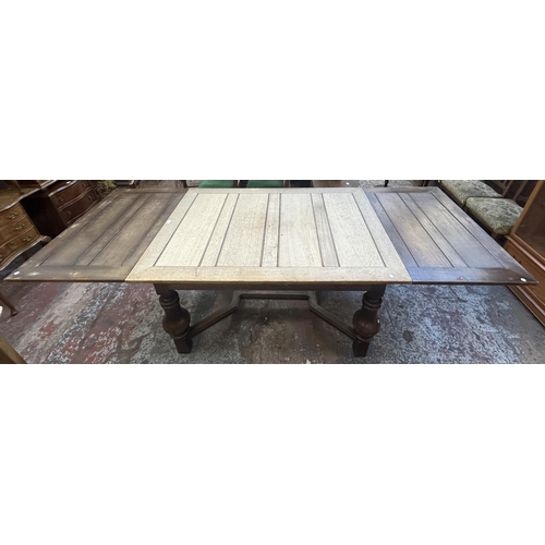 179 - A 1930s oak draw leaf dining table - approx. 78cm high x 100cm wide x 140cm long